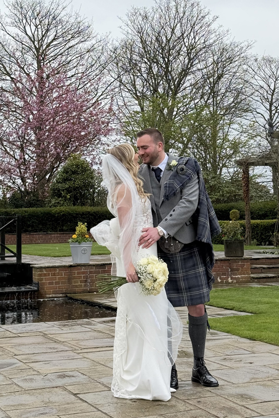Bride and groom embrace by Unveiled Moments, wedding content creator